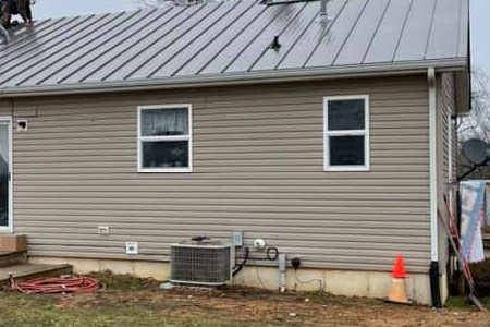 Close up of vinyl siding on a home in ofallon mo after summer rain